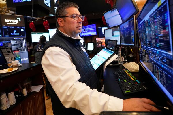 Trader Michael Capolino works on the floor of the New York Stock Exchange, Monday, April 21, 2025. (AP Photo/Richard Drew)