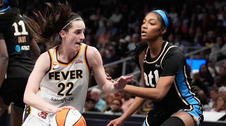 Indiana Fever's Caitlin Clark (22) dribbles the ball against Atlanta Dream forward Angel Reese (5) in the second half of an WNBA basketball game Sunday, Aug. 16, 2026, in Atlanta. (AP Photo/Brynn Anderson)