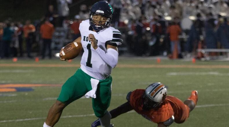 Harrison High School quarterback Justin Fields (1) runs the ball during a game against North Cobb High School, Friday, Sept. 1, 2017, in Kennesaw, Ga. BRANDEN CAMP/SPECIAL