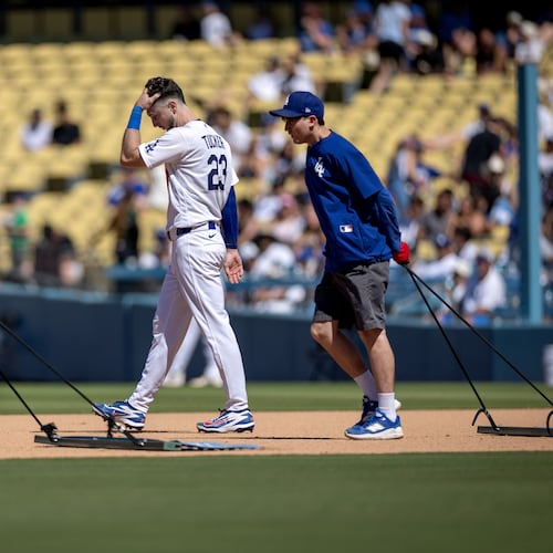 Los Angeles Dodgers' Kyle Tucker (23) walks to the outfield after grounding out during the seventh inning of a baseball game against the Milwaukee Brewers, Sunday, Aug. 16, 2026, in Los Angeles. (Eric Thayer/Los Angeles Times via AP)