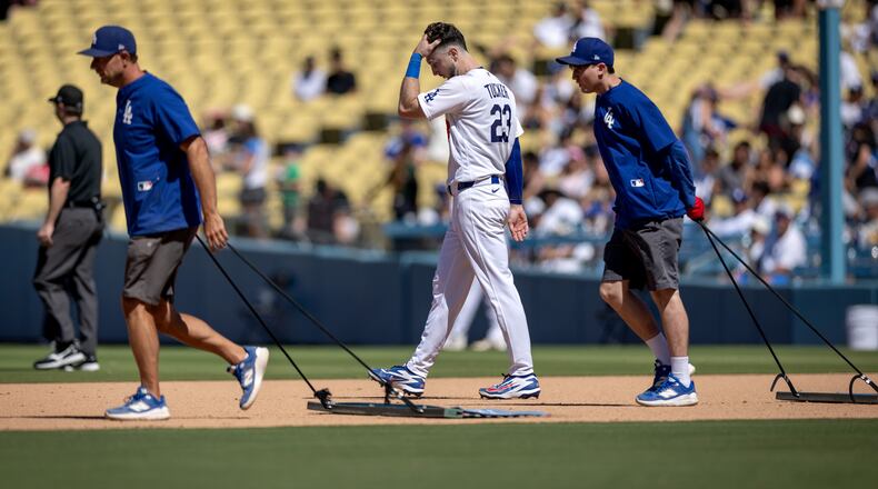 Los Angeles Dodgers' Kyle Tucker (23) walks to the outfield after grounding out during the seventh inning of a baseball game against the Milwaukee Brewers, Sunday, Aug. 16, 2026, in Los Angeles. (Eric Thayer/Los Angeles Times via AP)