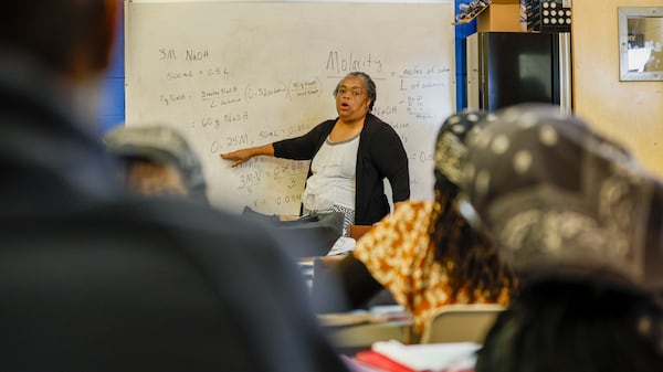 Chemistry teacher Angela Paul teaches students the difference between molarity and molality at DeKalb Christian Home Educators co-op, March 26, 2025. (Miguel Martinez/AJC)