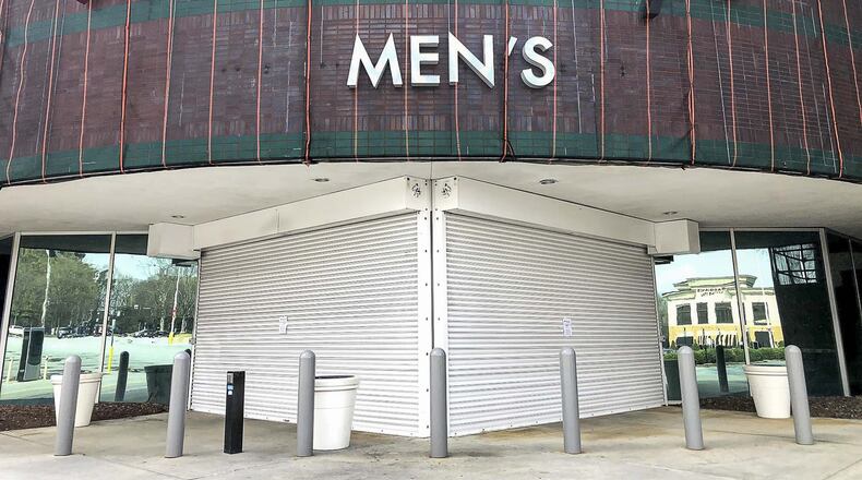 Outside the entrance door of Macy’s at Perimeter Center Mall in Dunwoody on Wednesday, March, 18, 2020, after the department store chain temporarily shut its doors. (ALYSSA POINTER/ALYSSA.POINTER@AJC.COM)