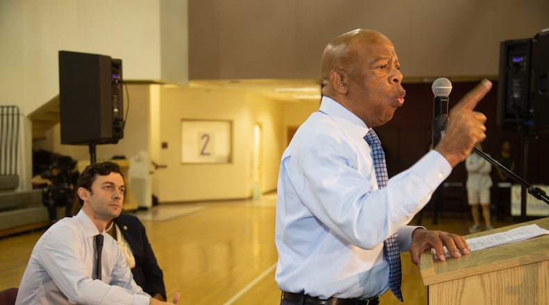 U.S. Rep. John Lewis talks to the crowd as Senate candidate Jon Ossoff looks on during a  voter registration rally at the MLK Recreation Center in Atlanta on Saturday, September 28, 2019. (Photo: STEVE SCHAEFER / SPECIAL TO THE AJC)