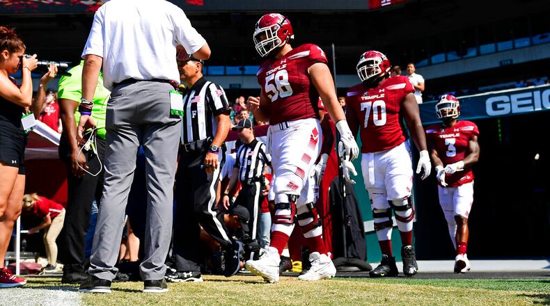 Temple offensive lineman Matt Hennessy (58) walks onto the field before an NCAA football game against Bucknell at Lincoln Financial Field on Saturday, Aug. 31, 2019 in Philadelphia. (AP Photo/Corey Perrine)