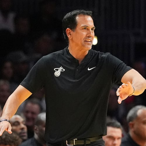 Miami Heat head coach Erik Spoelstra directs his players during the second half of an Emirates NBA Cup basketball game against the Milwaukee Bucks, Wednesday, Nov. 26, 2025, in Miami. (AP Photo/Rebecca Blackwell)