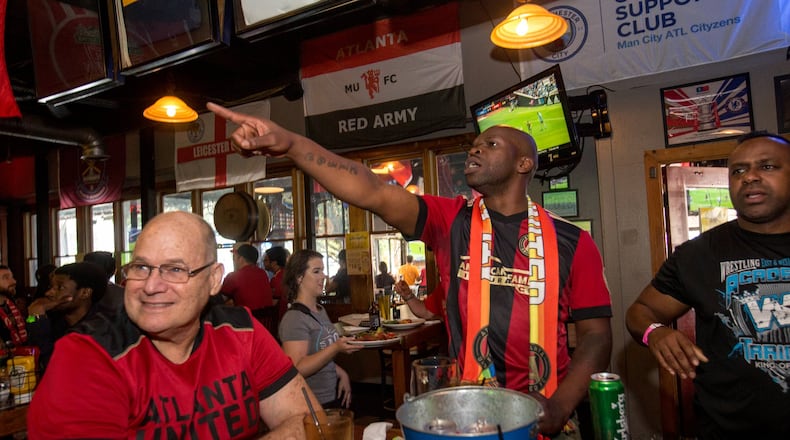 Atlanta United fans, including (from left) Jim Herald, James D. Dixon III and Tony Broughton, gather at Brewhouse in Little Five Points. (Jenni Girtman / Atlanta Event Photography)