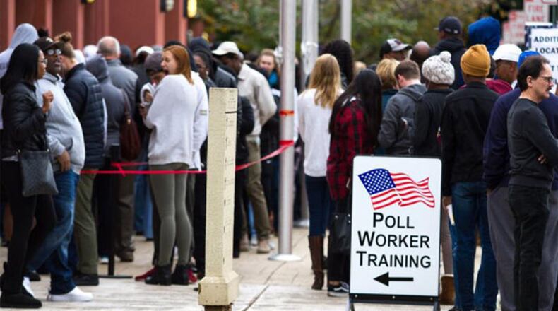 People wait in a line to vote in 2018. STEVE SCHAEFER / SPECIAL TO THE AJC