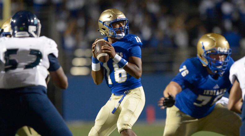 High School football: McEachern QB Carlos Del Rio (18) drops back to pass during the first half of Friday's home game against Cedar Grove. (Daniel Varnado/Special)