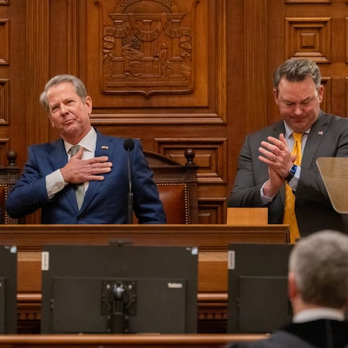 Gov. Brian Kemp, between Speaker Jon Burns and Lt. Gov. Burt Jones, waves after his final State of the State speech in the House of Representatives at the Capitol in Atlanta on Thursday, Jan. 15, 2026. (Arvin Temkar/AJC)
