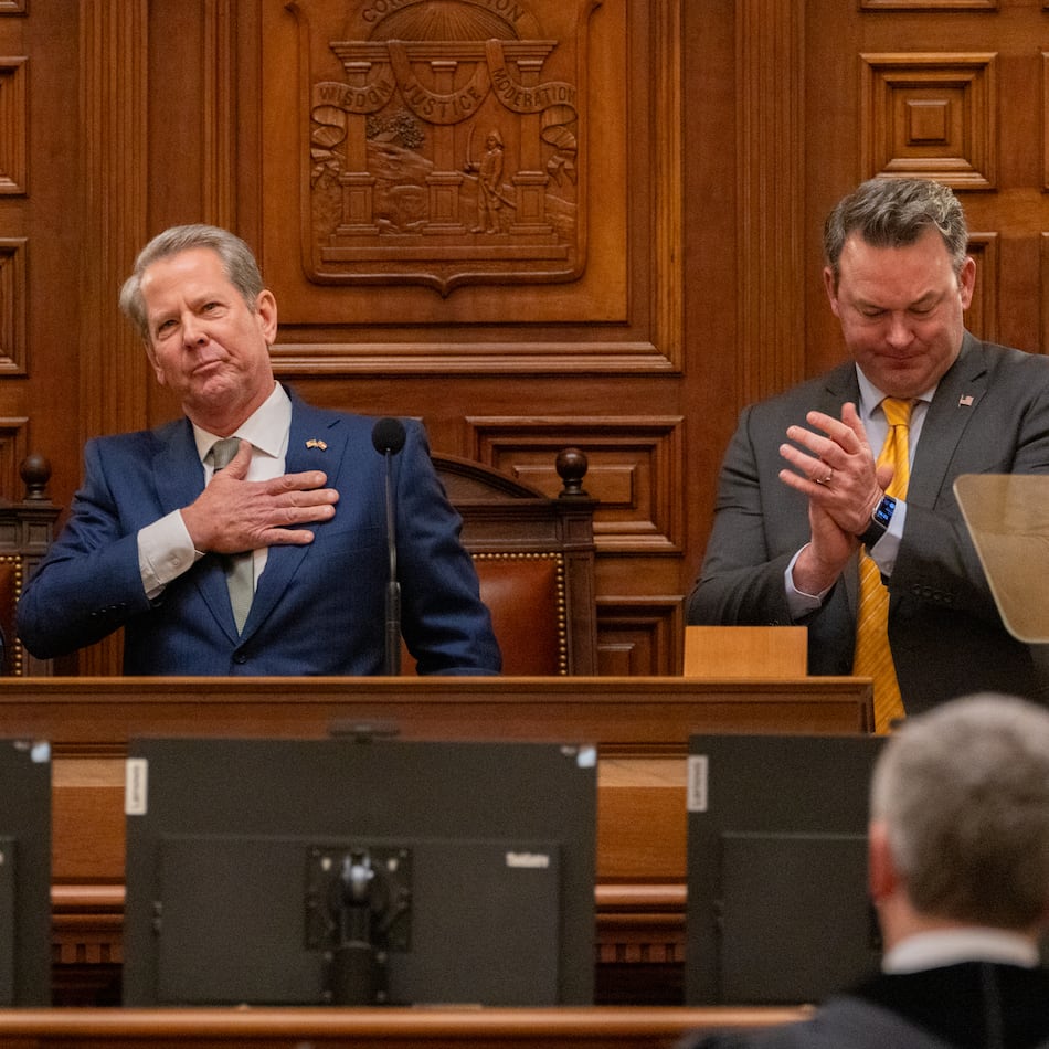 Gov. Brian Kemp, between Speaker Jon Burns and Lt. Gov. Burt Jones, waves after his final State of the State speech in the House of Representatives at the Capitol in Atlanta on Thursday, Jan. 15, 2026. (Arvin Temkar/AJC)