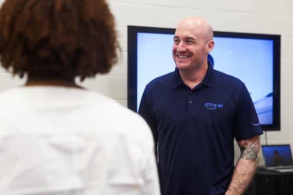 Jeff Cleland, head of U.S. regulatory affairs for Amazon Prime Air, explained the drone technology during a meeting Thursday in Snellville. (Abbey Cutrer/AJC)