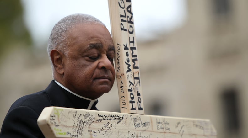 March 25, 2016 Atlanta - Archbishop Wilton D. Gregory 
closes his eyes in prayer at the second station of the cross at Talmadge Park. Attendants commemorated the stations of the cross along the pilgrimage and reflected on issues at every station. TAYLOR CARPENTER / TAYLOR.CARPENTER@AJC.COM