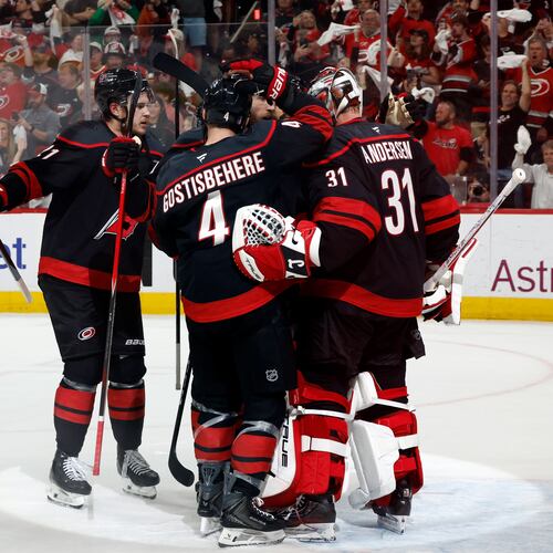 Carolina Hurricanes players join goaltender Frederik Andersen (31) following Game 5 of the Eastern Conference finals NHL hockey Stanley Cup playoff series against the Montreal Canadiens in Raleigh, N.C., Friday, May 29, 2026. (AP Photo/Karl DeBlaker)