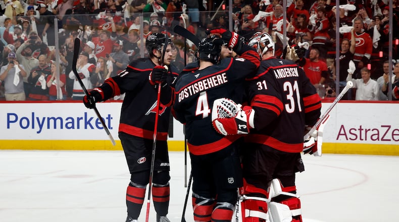 Carolina Hurricanes players join goaltender Frederik Andersen (31) following Game 5 of the Eastern Conference finals NHL hockey Stanley Cup playoff series against the Montreal Canadiens in Raleigh, N.C., Friday, May 29, 2026. (AP Photo/Karl DeBlaker)