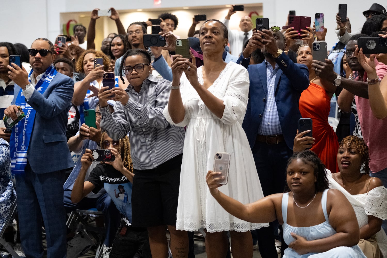 People look for their graduates during the procession at the Spelman College graduation ceremony at the Georgia International Convention Center in College Park on Sunday, May 18, 2025.   Ben Gray for the Atlanta Journal-Constitution