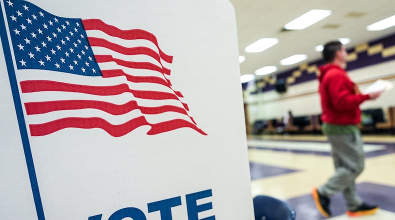 A person votes in the Virginia redistricting referendum at Lake Braddock Secondary School, Tuesday, April 21, 2026, in Burke, Va. (AP Photo/Julia Demaree Nikhinson)