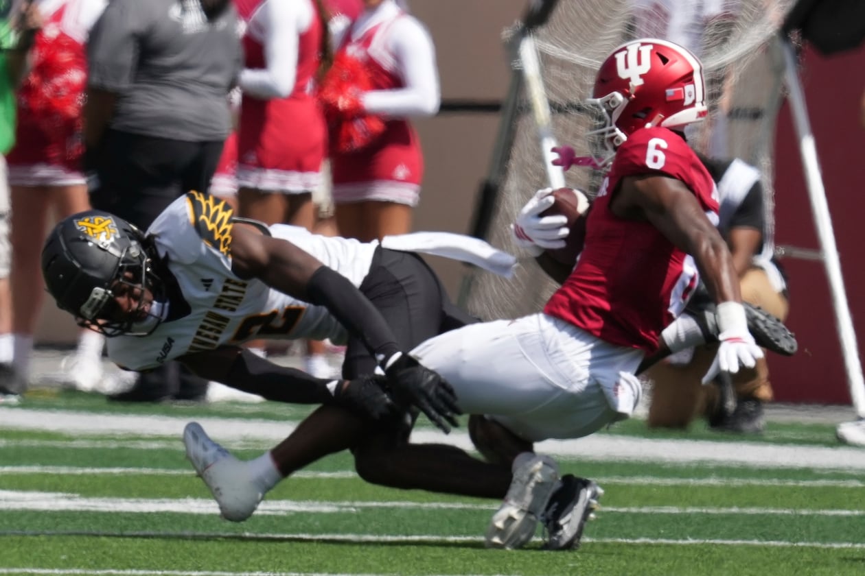 Indiana wide receiver LeBron Bond (right) is tackled by Kennesaw State defensive back Caleb Offord during the first half of an NCAA college football game, Saturday, Sept. 6, 2025, in Bloomington, Indiana. (Darron Cummings/AP)