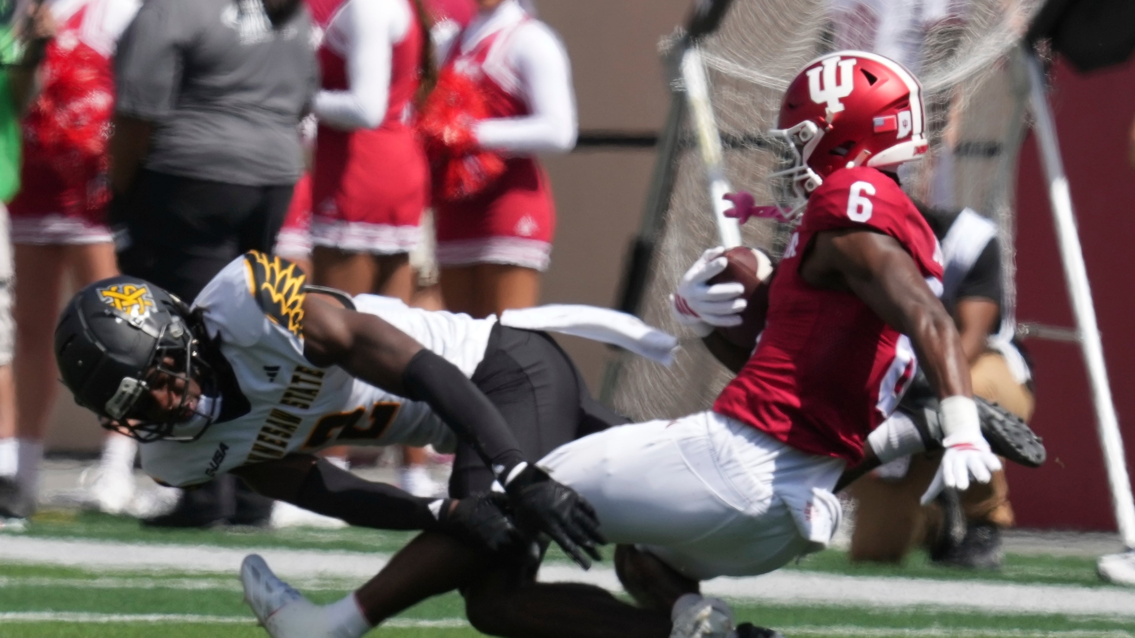 Indiana wide receiver LeBron Bond (6) is tackled by Kennesaw State defensive back Caleb Offord (2) during the first half of an NCAA college football game, Saturday, Sept. 6, 2025, in Bloomington, Ind. (AP Photo/Darron Cummings)