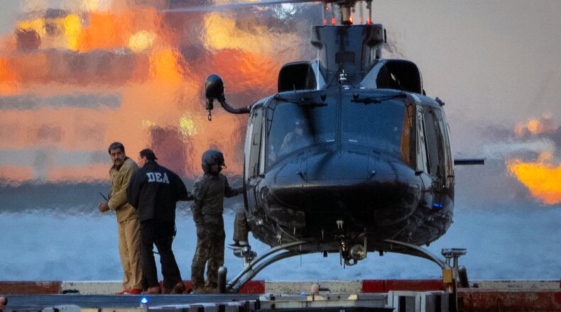 Nicolas Maduro, the ousted president of Venezuela, is escorted off a helicopter en route to a federal courthouse in Manhattan in January. Maduro was expected to face charges of drug trafficking and other crimes, two days after he was captured in a U.S. military raid in Caracas. (Vincent Alban/The New York Times)