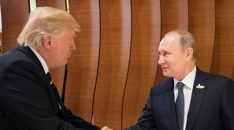 Russian President Vladimir Putin, right, is advised daily about President Donald Trump's tweets.