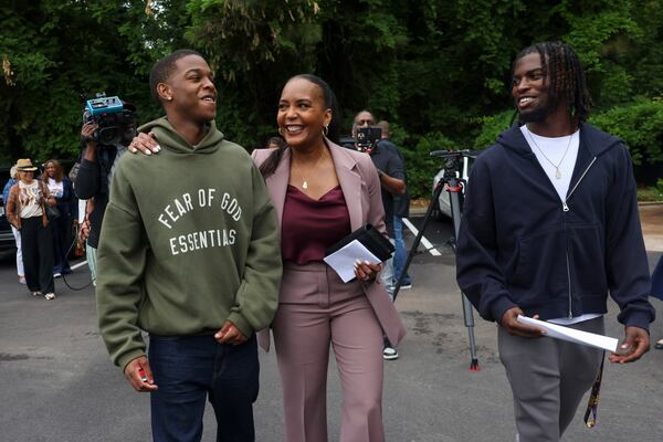 Democratic candidate for governor, Keisha Lance Bottoms, former Atlanta mayor (center) walks with her son, Langston Bottoms (left) and Zaydn, last name withheld (right), as they move toward the precinct to vote in the Georgia Democratic primary at the City of South Fulton Southwest Arts Center, Thursday, May 7, 2026, in Atlanta. (Jason Getz/AJC)