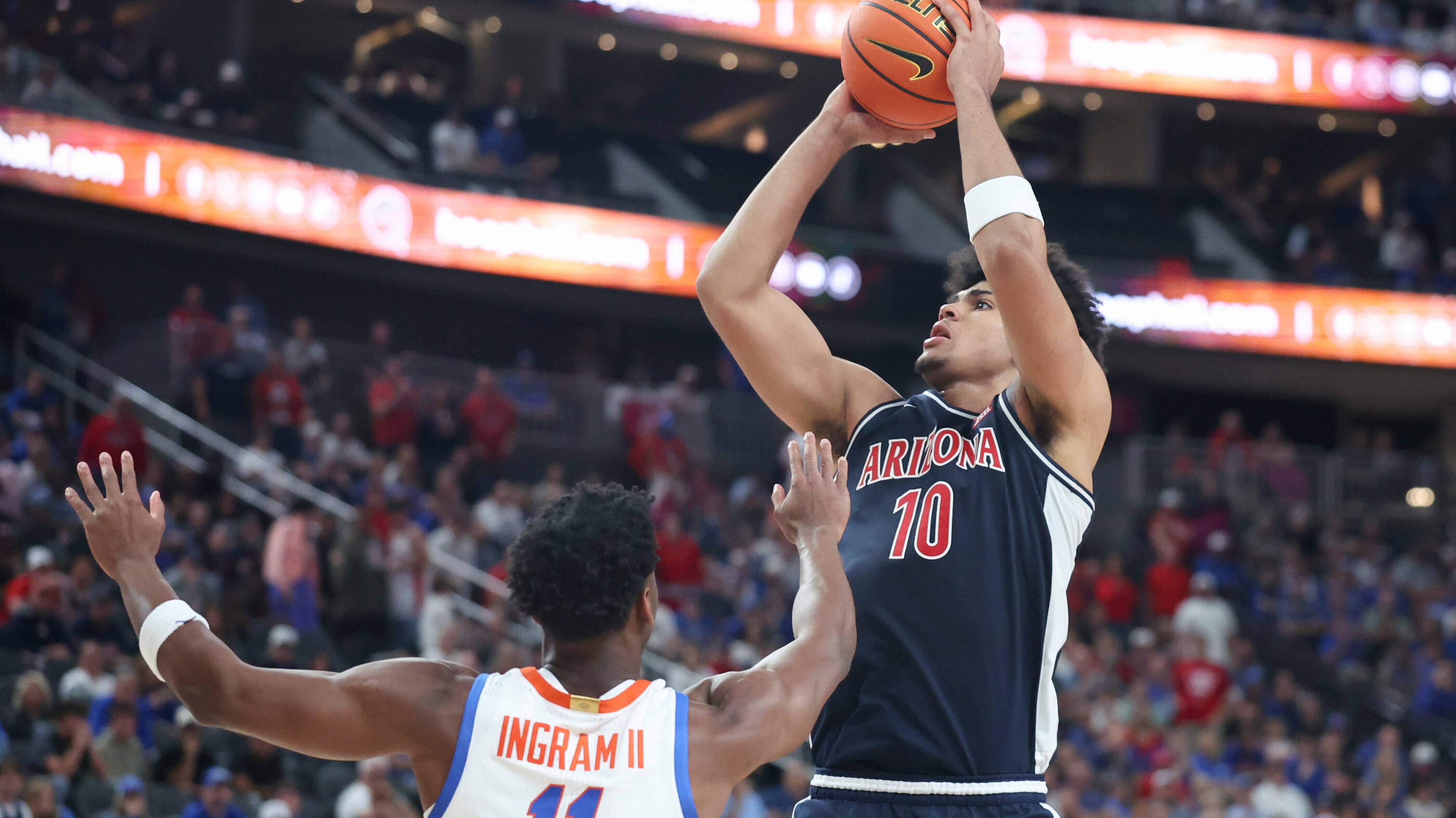 Arizona forward Koa Peat (10) shoots against Florida guard CJ Ingram (11) during the second half of an NCAA college basketball game, Monday, Nov. 3, 2025, in Las Vegas. (AP Photo/Ian Maule)