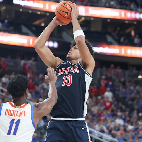 Arizona forward Koa Peat (10) shoots against Florida guard CJ Ingram (11) during the second half of an NCAA college basketball game, Monday, Nov. 3, 2025, in Las Vegas. (AP Photo/Ian Maule)