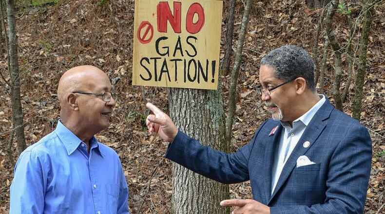 Stonecrest Mayor Jason Lary (right) and Councilman George Turner visit the site of the proposed gas station and convenience store earlier this year.