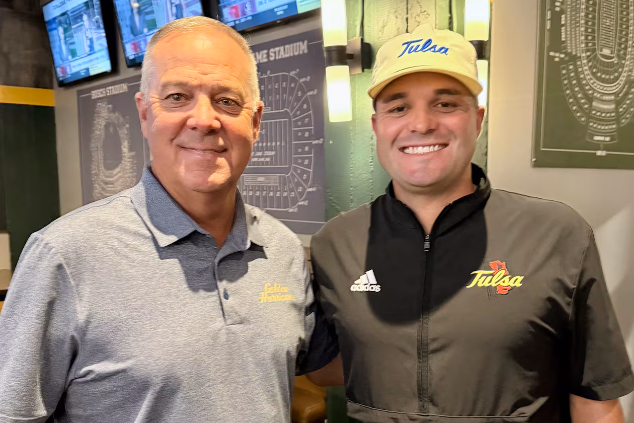 Longtime Calhoun coach Hal Lamb (left) poses with his son Tre Lamb, now head coach at the University of Tulsa.