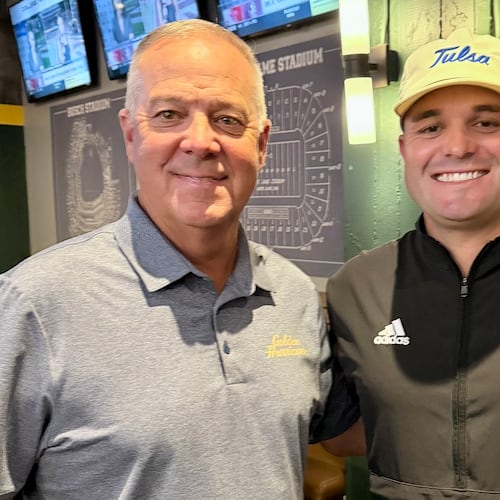 Longtime Calhoun coach Hal Lamb (left) poses with his son Tre Lamb, now head coach at the University of Tulsa.