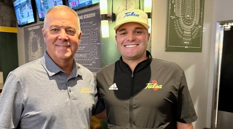 Longtime Calhoun coach Hal Lamb (left) poses with his son Tre Lamb, now head coach at the University of Tulsa.