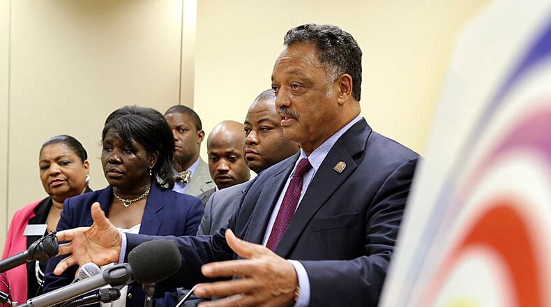 From left: Georgia Senator, Gail Davenport, Carrie Johnson, Eugene Felton, Chris Stewart, Robert Patillo and Jesse Jackson at the Hyatt Regency in downtown Atlanta. A federal lawsuit was filed Nov. 1, 2013 challenging Georgia's "Stand Your Ground" law, claiming that the seven-year-old statute is too vague and unconstitutional.