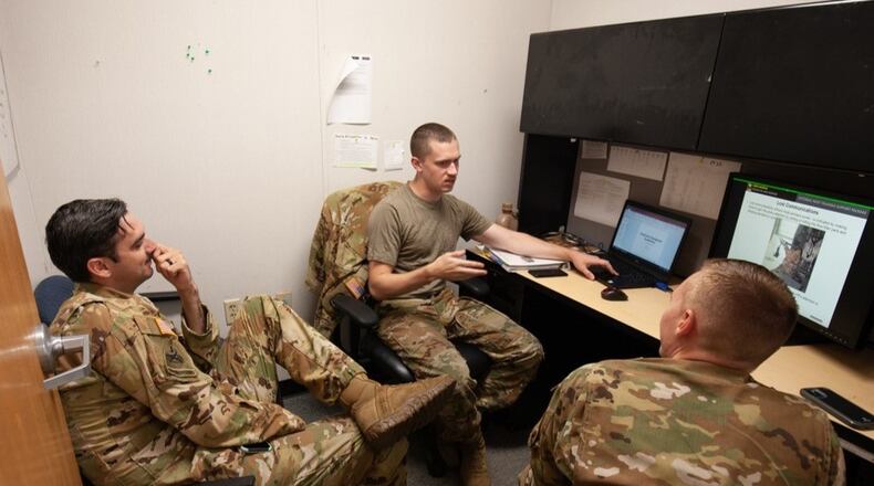 Ryan O'Hara (center) speaks about helicopter rescue hoist academics prior to a training flight in January 2022. O'Hara was one of three soldiers killed on the helicopter that collided with a passenger jet at Ronald Reagan National Airport on Wednesday.