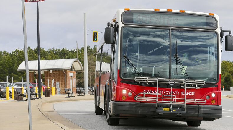 A Gwinnett County Transit bus travels along North Brown Road near a Gwinnett County Transit Park and Ride bus station in Lawrenceville on Tuesday, Feb. 26, 2019. (ALYSSA POINTER/ALYSSA.POINTER@AJC.COM)