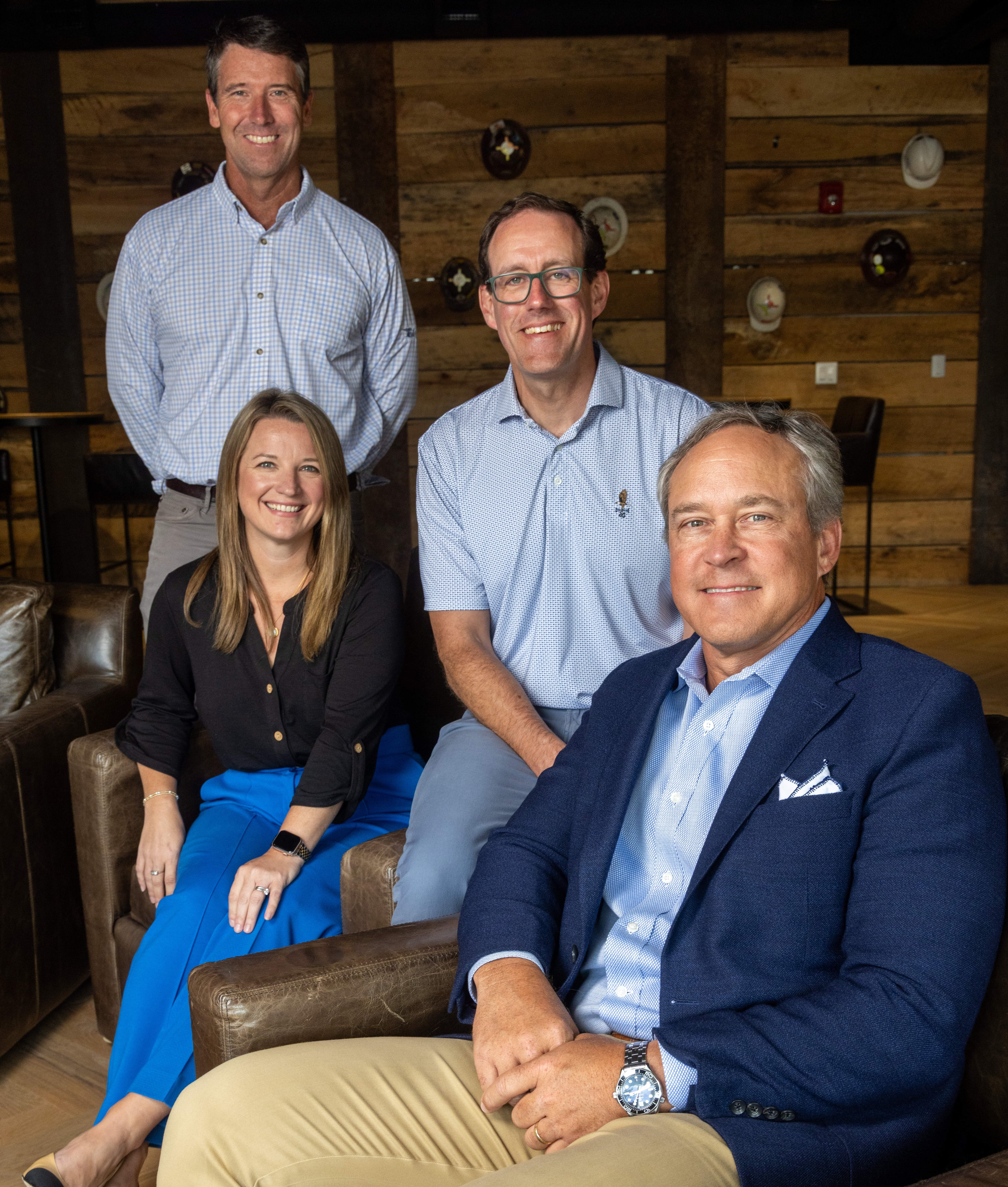 The leadership team at Brasfield & Gorrie's Atlanta office includes Wes Murrell (standing), Greg Hunsberger (seated next to Wes), Keith Johnson, and Jodi Taylor. (Phil Skinner for the AJC)