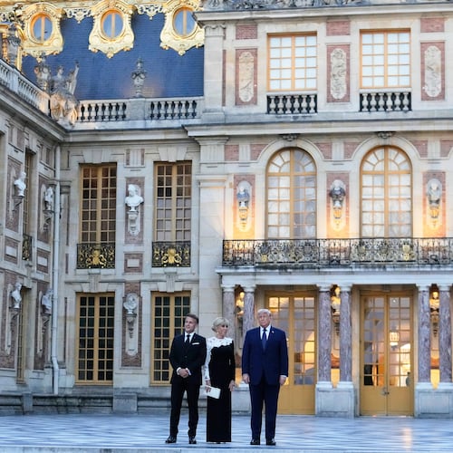 France's President Emmanuel Macron, left, his wife Brigitte, left, and U.S. President Donald Trump pose before a private dinner to celebrate the USA's 250th birthday, at the Palace of Versailles, outside Paris, Wednesday, June 17, 2026. (AP Photo/Michel Euler)