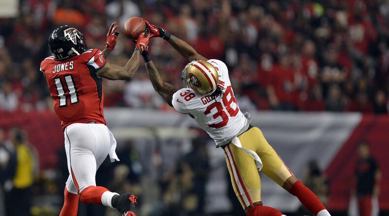 January 20, 2013, Atlanta-Falcons wide receiver Julio Jones comes up with a pass through the fingertips of 49ers free safety Dashon Goldson during the first quarter of the NFC Championship game Sunday afternoon Jan. 20, 2013 at the Georgia Dome. The play was good for 27 yards and a first down. BRANT SANDERLIN / BSANDERLIN@AJC.COM