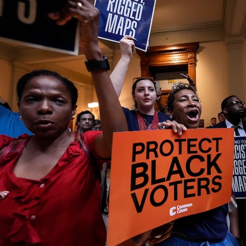 People listen and cheer as lawmakers speak about redistricting during a special legislative session at the state capitol, Wednesday, June 17, 2026, in Atlanta. (AP Photo/Mike Stewart)