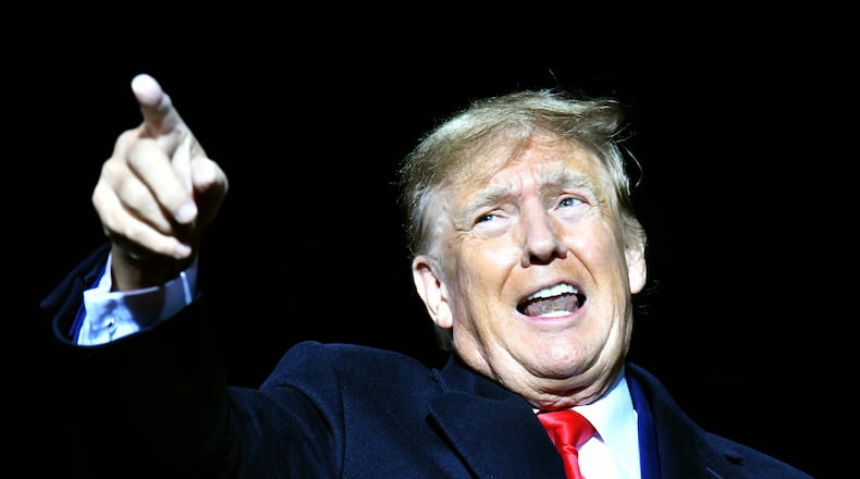 Former President Donald Trump speaks during a rally for Georgia GOP candidates at Banks County Dragway in Commerce on Saturday, March 26, 2022. (Hyosub Shin / Hyosub.Shin@ajc.com)