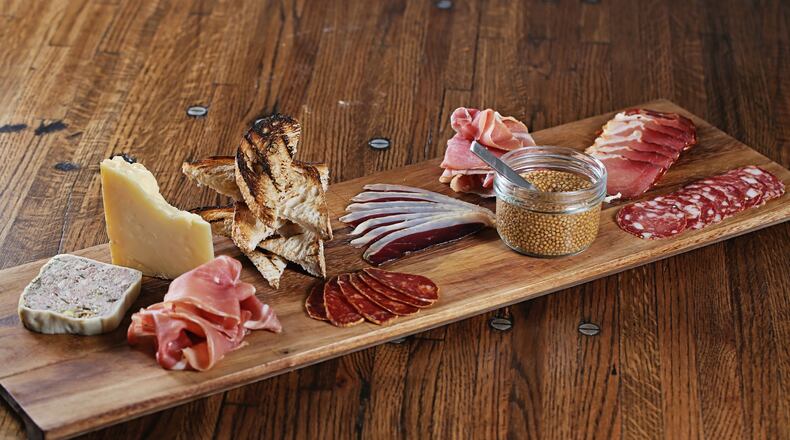 A charcuterie plate at Saltwood Charcuterie & Bar, which recently opened inside the Loews Atlanta Hotel in Midtown. Photo credit: Sara Hanna Photography