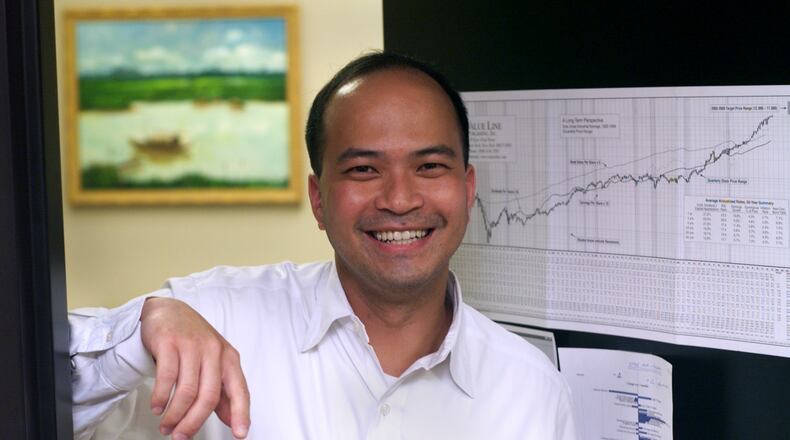 GOP activist Baoky Vu of Decatur. AIn this July photo, the Olympic rings and torch from the 1996 Summer Olympic Games in Atlanta stand near the formerly named Centennial Olympic Stadium, now Turner Field, home of the Atlanta Braves baseball team in Atlanta. AP/David GoldmanJC file