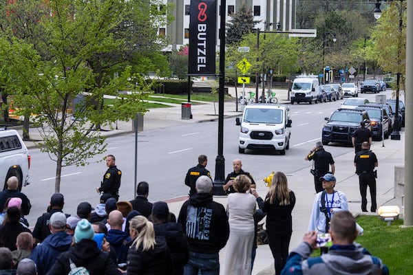 A van carrying former Grand Rapids Police officer Christopher Schurr arrives at the Kent County Courthouse in Grand Rapids, Mich. on Friday, May 2, 2025. (Joel Bissell /Kalamazoo Gazette via AP)