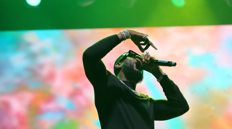 Rapper Gucci Mane performs alongside music producer Jermaine Dupri, during Dupri's "The South Got Something to Say" show at the Caesars Superdome in New Orleans. He'll perform at Atlanta Symphony Hall this fall. (TYSON HORNE / TYSON.HORNE@AJC.COM)