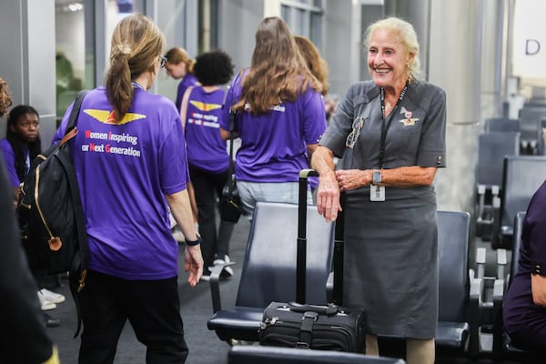 A flight attendant readies for departure from Hartsfield-Jackson Atlanta International Airport on Friday, Sept. 19, 2025. A 2022 Women in Aviation advisory board report found the introduction of women into the aviation industry has been stagnant in nearly every specialty for the last 60 years. (Abbey Cutrer/AJC)