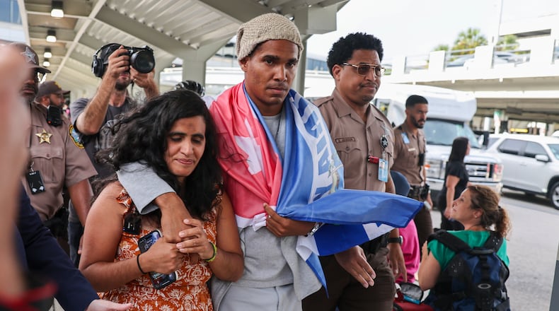 Cuban dissident artist Luis Manuel Otero Alcántara arrives at Miami International Airport on Saturday, July 18, 2026, after serving a five-year prison sentence in Cuba. (AP Photo/David Santiago)
