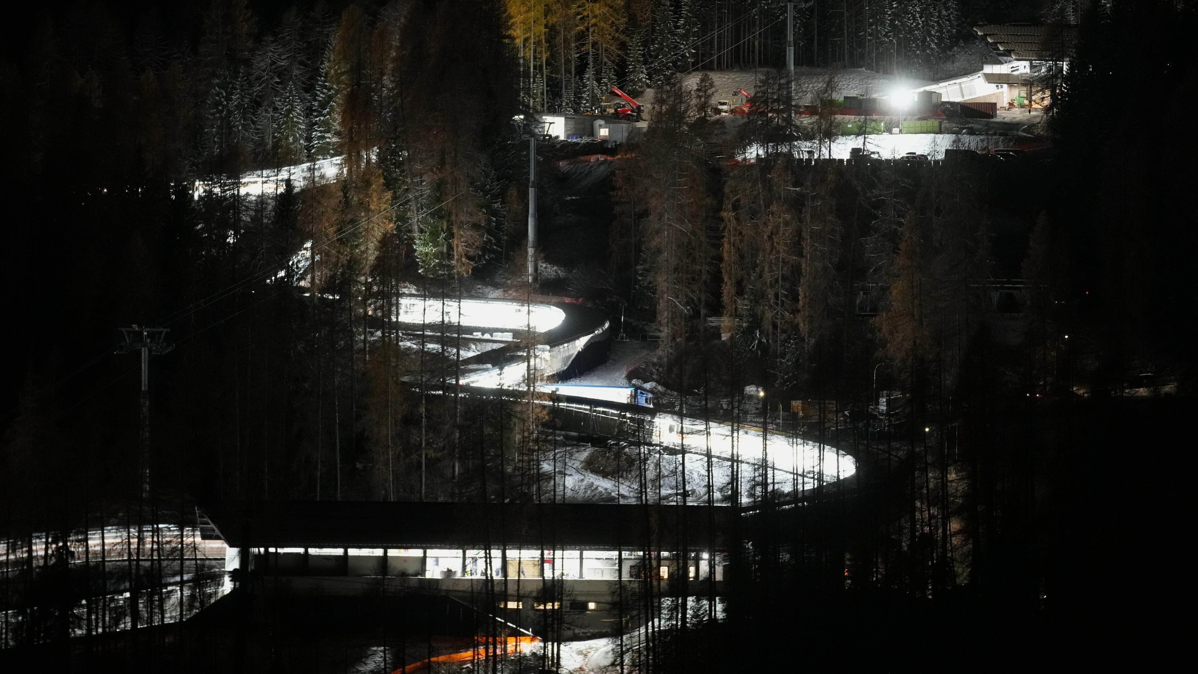 A night view of the Eugenio Monti sliding track during a three day skeleton and bobsled World Cup stage and Olympic test event in Cortina D'Ampezzo, Friday, Nov. 21, 2025. (AP Photo/Andrew Medichini)