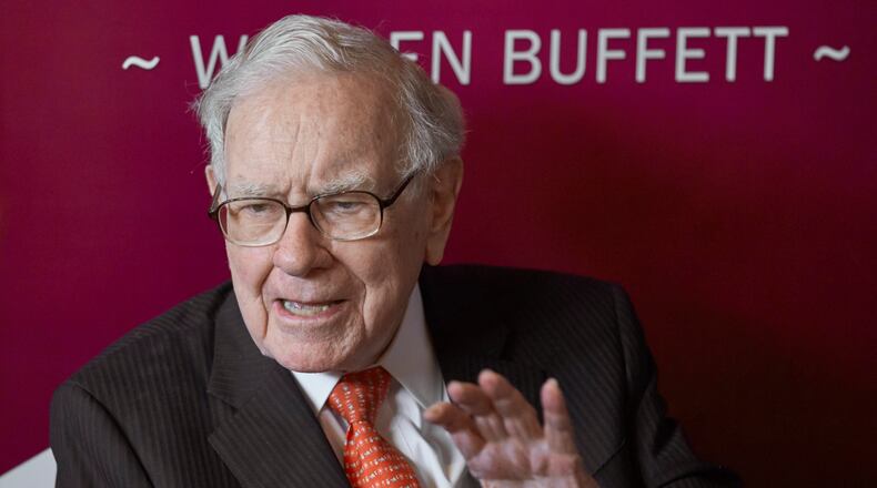 FILE - Warren Buffett, chairman and CEO of Berkshire Hathaway, speaks during a game of bridge following the annual Berkshire Hathaway shareholders meeting May 5, 2019, in Omaha, Neb. (AP Photo/Nati Harnik, File)
