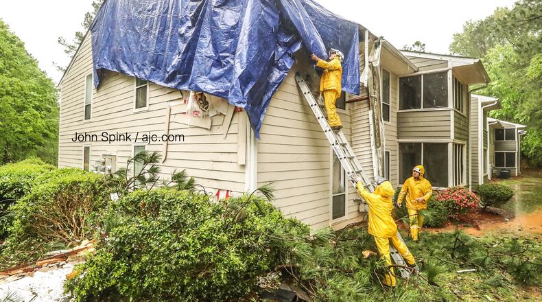 Gwinnett County firefighters responded just after 5 a.m. Friday to a report of a tree down on a building at the Columns at Peachtree Corners apartments.