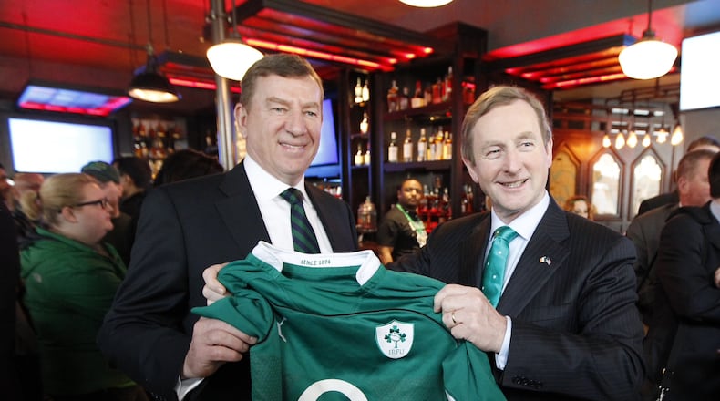 Irish Prime Minister Enda Kenny (R) and Fado Irish Pub and Restaurant owner Kieran McGill hold a jersey after the Prime Minister stopped by for the grand opening of the pub and to watch the Ireland National Rugby team in Atlanta, Georgia March 14 2015. Kenny is in town to be the Grand Marshall for the Atlanta St. Patricks Day Parade. REUTERS/HANDOUT (UNITED STATES) Irish Prime Minister Enda Kenny (R) and Fado Irish Pub and Restaurant owner Kieran McGill. (REUTERS/HANDOUT)